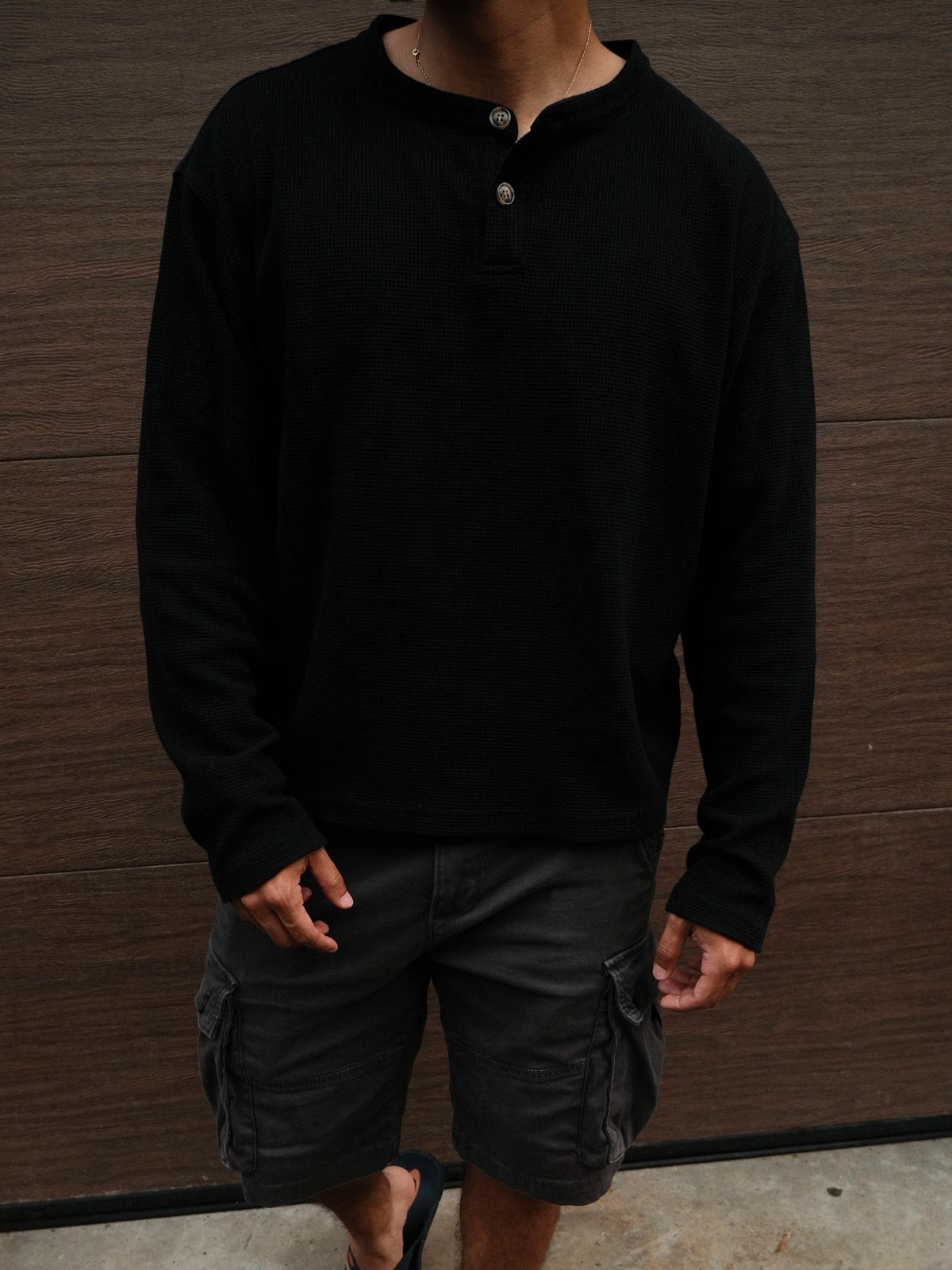 Model wearing the Waffle Knit Black Henley, front view